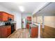 Spacious kitchen featuring stainless steel appliances, sleek countertops, stylish cabinets and hardwood floors at 1905 Granville Dr, Lawrenceville, GA 30043