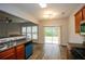 Open floor plan with kitchen, stainless steel sinks and access to a backyard at 1905 Granville Dr, Lawrenceville, GA 30043