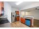 Bright kitchen with stainless steel refrigerator, hardwood floors, and wooden cabinets at 1905 Granville Dr, Lawrenceville, GA 30043