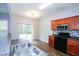 Bright kitchen with stainless steel appliances, double sinks, and access to the backyard through a sliding door at 1905 Granville Dr, Lawrenceville, GA 30043