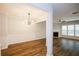 Bright open-concept living and dining area with fireplace, large windows, and hardwood floors at 1905 Granville Dr, Lawrenceville, GA 30043