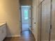 Bathroom showing doorway, linen closet, and a tiled shower with a glass enclosure at 30 Riverrock Trl, Dallas, GA 30157