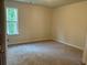 Bedroom features plush carpeting and a window providing natural light at 30 Riverrock Trl, Dallas, GA 30157