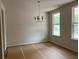 Bright dining room with natural light, classic chandelier, and neutral color palette at 30 Riverrock Trl, Dallas, GA 30157