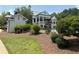 Beautiful community clubhouse view, swimming pool, and well-manicured landscaping at 30 Riverrock Trl, Dallas, GA 30157