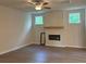 Bright living room with a modern fireplace, and wood flooring at 30 Riverrock Trl, Dallas, GA 30157