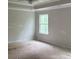 Unfurnished main bedroom with a view of wooded area behind the house at 30 Riverrock Trl, Dallas, GA 30157