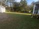 Large backyard with green lawn and storage shed, perfect for outdoor activities at 4691 Bo Hendrick Dr, Austell, GA 30106