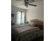 Comfortable bedroom with a ceiling fan and natural light streaming through the window at 4691 Bo Hendrick Dr, Austell, GA 30106
