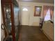 Cozy entryway featuring hardwood floors and a view into the living room at 4691 Bo Hendrick Dr, Austell, GA 30106