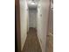 Bright hallway with wood flooring and white walls, leading to various rooms at 4691 Bo Hendrick Dr, Austell, GA 30106