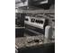 Kitchen view showcasing granite countertops and stainless steel stovetop at 4691 Bo Hendrick Dr, Austell, GA 30106