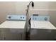 Convenient laundry room with a side-by-side washer and dryer set, ready for everyday use at 4691 Bo Hendrick Dr, Austell, GA 30106
