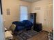 A home office with blue accent chairs and a stylish rug at 4691 Bo Hendrick Dr, Austell, GA 30106