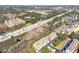 Aerial view of neighborhood, lush trees, and busy highway at 4852 Merriman Se Walk # 23, Atlanta, GA 30339