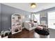 Stylish bedroom with a dollhouse, canopied bed, and elegant decor at 4852 Merriman Se Walk # 23, Atlanta, GA 30339