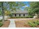 Neighborhood clubhouse with surrounding trees, bushes and greenery at 4852 Merriman Se Walk # 23, Atlanta, GA 30339