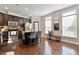 Stylish kitchen boasts stainless steel appliances, granite countertops, and a cozy breakfast bar at 4852 Merriman Se Walk # 23, Atlanta, GA 30339