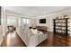 Bright living room with a neutral color palette and hardwood floors, plus a decorative bookcase at 4852 Merriman Se Walk # 23, Atlanta, GA 30339