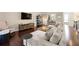 Spacious living room featuring modern furnishings and hardwood floors, creating an inviting space at 4852 Merriman Se Walk # 23, Atlanta, GA 30339