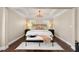 Inviting main bedroom with cozy rug, tray ceilings, and warm lighting at 4852 Merriman Se Walk # 23, Atlanta, GA 30339