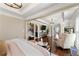 Elegant main bedroom boasts a sitting area and hardwood floors at 4852 Merriman Se Walk # 23, Atlanta, GA 30339