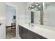 Bathroom with gray vanity with a modern countertop sink and shower featuring floral shower curtain at 5200 Peachtree Rd # 1111, Atlanta, GA 30341