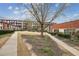 Charming courtyard area featuring landscaping, sidewalks, and a multi-story brick building at 5200 Peachtree Rd # 1111, Atlanta, GA 30341