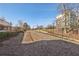 Building exterior featuring landscaping and fenced in area at 5200 Peachtree Rd # 1111, Atlanta, GA 30341