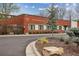 Brick building with well-maintained landscaping and visible address numbers at 5200 Peachtree Rd # 1111, Atlanta, GA 30341