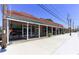 Storefront of various businesses with awnings and large glass windows at 5200 Peachtree Rd # 1111, Atlanta, GA 30341
