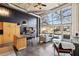 Open living area with large windows, modern furnishings and high ceilings at 5200 Peachtree Rd # 1111, Atlanta, GA 30341