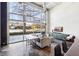 Bright living area with industrial-style windows and modern decor at 5200 Peachtree Rd # 1111, Atlanta, GA 30341