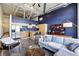 Open-concept living room with kitchen, high ceilings, and modern furnishings at 5200 Peachtree Rd # 1111, Atlanta, GA 30341