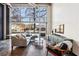 Inviting living space with large windows and comfortable seating arrangement at 5200 Peachtree Rd # 1111, Atlanta, GA 30341