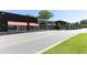 Shopping center with multiple stores, awnings, and street parking at 5200 Peachtree Rd # 1111, Atlanta, GA 30341