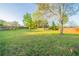 Expansive backyard with lush lawn and mature trees, ideal for outdoor activities at 895 Tyrell Dr, Austell, GA 30106