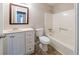 Clean bathroom featuring a vanity with storage, a toilet, and a shower/tub combo at 895 Tyrell Dr, Austell, GA 30106