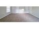 Bedroom featuring neutral walls, plush carpet, and two closets at 895 Tyrell Dr, Austell, GA 30106