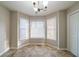 Cozy breakfast nook featuring a bay window and a stylish chandelier at 895 Tyrell Dr, Austell, GA 30106