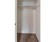 A walk-in closet with carpeted flooring and a shelf with a hanging rod, providing essential storage space at 895 Tyrell Dr, Austell, GA 30106