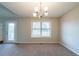 Bright living room with cozy carpet and large windows, perfect for relaxation and entertaining at 895 Tyrell Dr, Austell, GA 30106