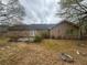 Spacious backyard featuring a patio and partial brick landscaping, offering outdoor relaxation and enjoyment at 1430 Country Lane Ne Dr, Conyers, GA 30012