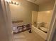 Bathroom featuring a tub with ceramic tile, and space for renovations at 1430 Country Lane Ne Dr, Conyers, GA 30012