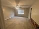 Spacious bedroom featuring neutral walls, ceiling fan, natural light, and unfinished flooring at 1430 Country Lane Ne Dr, Conyers, GA 30012