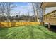 Well-maintained backyard features a lush lawn, a wooden fence, and mature trees at 1967 Nash Se Ave, Atlanta, GA 30316