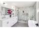 Modern bathroom with double vanity, marble accents, soaking tub, and a separate shower at 1967 Nash Se Ave, Atlanta, GA 30316