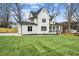 Exterior elevation showcasing a two-story modern farmhouse with a landscaped yard at 1967 Nash Se Ave, Atlanta, GA 30316