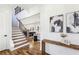 Inviting foyer with hardwood floors, stairway, and views of the living and dining spaces at 1967 Nash Se Ave, Atlanta, GA 30316