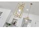 Modern gold pendant lighting above a kitchen island complements the design at 1967 Nash Se Ave, Atlanta, GA 30316